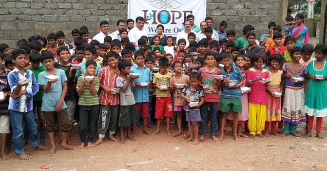 Children and Hope Foundation members together after a community meal service