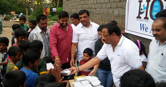 Hope Foundation members serving meals to children